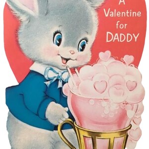 May include: Vintage Valentine's Day card featuring a cartoon bunny in a blue jacket and bow tie. The bunny holds a pink drink with heart-shaped foam in a gold cup. Text on the red heart background reads "A Valentine for DADDY."