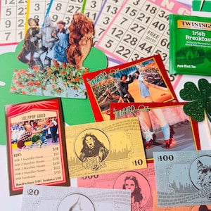 May include: A selection of Wizard of Oz themed items, including bingo cards, play money, and character cards. The bingo cards display numbers, while the play money features character portraits. The character cards depict scenes from the film.