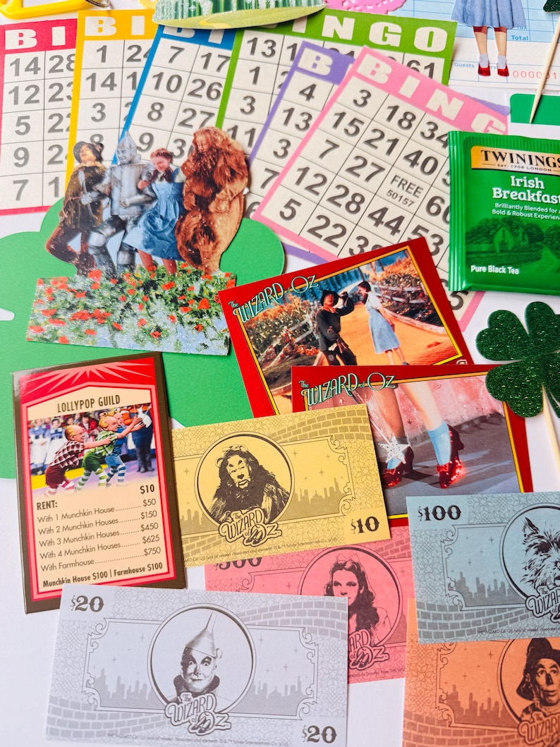 May include: A selection of Wizard of Oz themed items, including bingo cards, play money, and character cards. The bingo cards display numbers, while the play money features character portraits. The character cards depict scenes from the film.