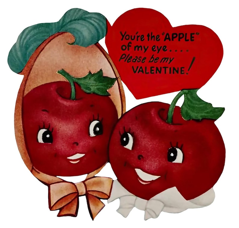 May include: A vintage Valentine's Day card showing two smiling red apples with cartoon faces. One apple wears a bonnet and bow. A red heart-shaped sign reads, "You're the 'APPLE' of my eye... Please be my VALENTINE!"