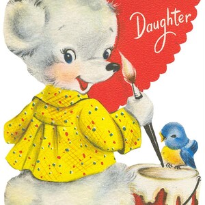 May include: Vintage greeting card featuring a cartoon bear in a yellow polka-dot dress, holding a paintbrush and painting a red heart. A bluebird sits on a paint bucket. The text on the heart reads, "To a Dear Little Daughter."