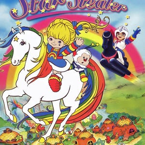 May include: DVD cover for "Rainbow Brite and the Star Stealer" features a cartoon scene with a blonde girl riding a white horse with a rainbow mane. A character in a helmet flies on a black vehicle. The title is in yellow and pink.