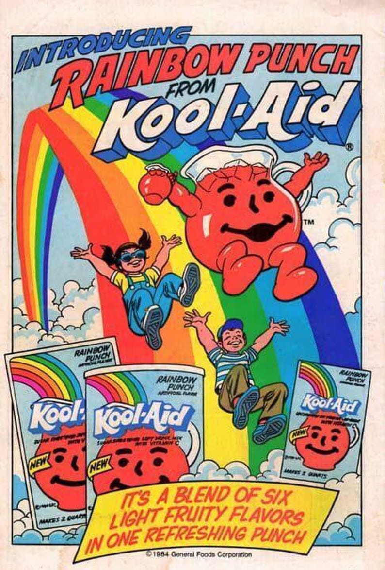 Puede incluir: Anuncio vintage de Kool-Aid con el personaje Kool-Aid Man, ni&ntilde;os y gr&aacute;ficos de arco&iacute;ris. El texto dice "Introducing Rainbow Punch from Kool-Aid". La imagen incluye el empaque del producto y el lema "It's a blend of six light fruity flavors in one refreshing punch".