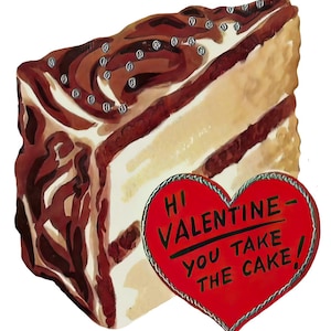 May include: A slice of cake with chocolate icing and silver sprinkles, beside a red heart-shaped card. The card reads "Hi Valentine - You Take The Cake!" in black text. The cake has a light brown and white interior.