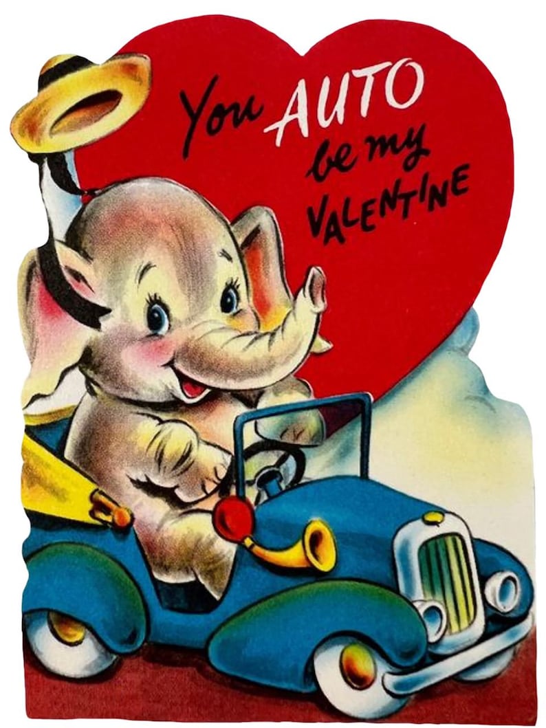 May include: Vintage Valentine's Day card featuring a cartoon elephant driving a blue car. The elephant has a hat and is smiling. A red heart with the words "You AUTO be my VALENTINE" is in the background.