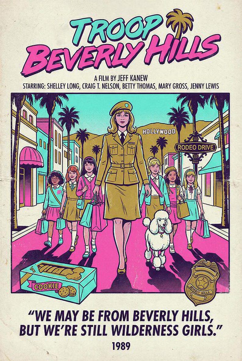 May include: A vintage-style poster for "Troop Beverly Hills" features a woman in a khaki uniform leading a group of girls down a pink street. The poster includes the text "Hollywood" and "Rodeo Drive."