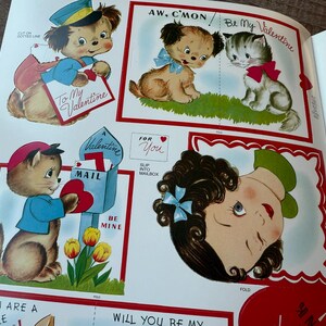 May include: A selection of vintage Valentine's Day cards featuring cartoon animals and a girl. The cards include a dog in a uniform, a puppy and kitten, and a cat with a mailbox. Text includes "To My Valentine" and "Be Mine."