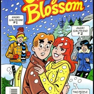 Może przedstawiać: Okładka komiksu "Cheryl Blossom" nr 19, przedstawiająca parę obejmującą się w zaśnieżonej scenerii. Tytuł jest w dużych ż&oacute;łtych literach z czerwonym obrysem. Okładka zawiera tekst "Angry Girlfriend" i "Two People in Big Trouble."