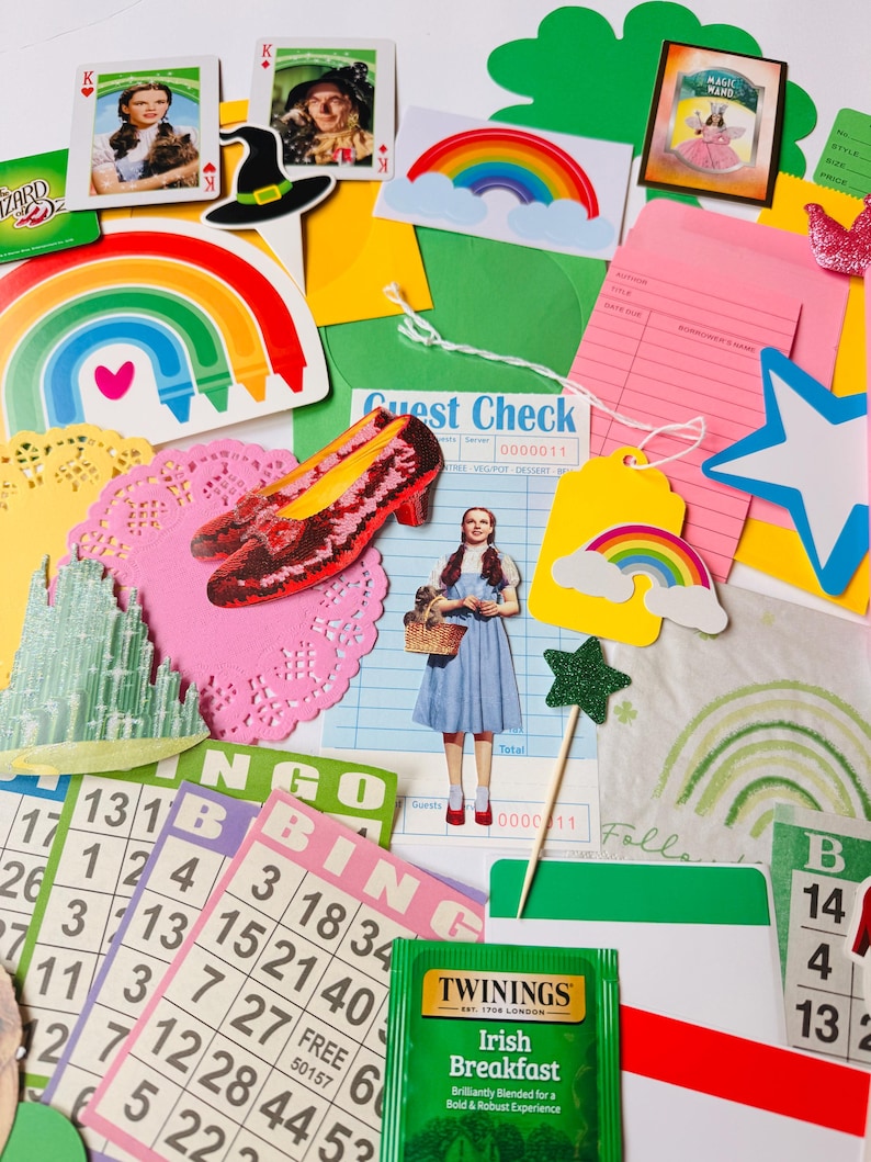 May include: A vibrant collection of Wizard of Oz-themed items, including images of Dorothy, the Wicked Witch's hat, ruby slippers, playing cards, rainbows, bingo cards, and a tea bag. The arrangement creates a nostalgic feel, with a variety of colours and shapes on a white background.