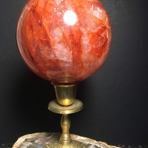 Fire quartz sphere, hematoid quartz sphere on vintage candle holder