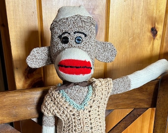 Sock Affe mit Kleidung und Geburtsurkunde