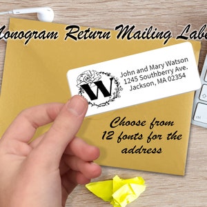 May include: A white return address label with a black floral monogram featuring the letter "W" and the text "John and Mary Watson, 1245 Southberry Ave., Jackson, MA 02354". The label is on a brown envelope with the text "Choose from 12 fonts for the address".