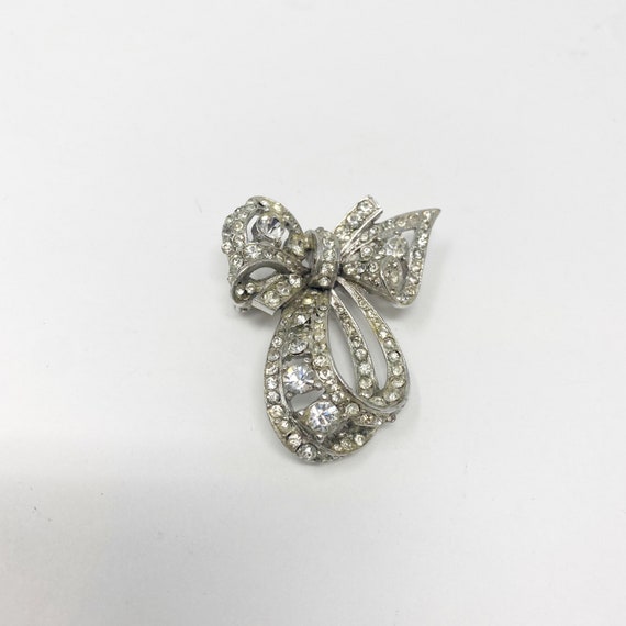 557 Vintage Reinad silver tone bow Brooch / Pin w… - image 1