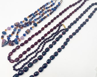 591 Collection of vintage maroon and purple glass necklaces