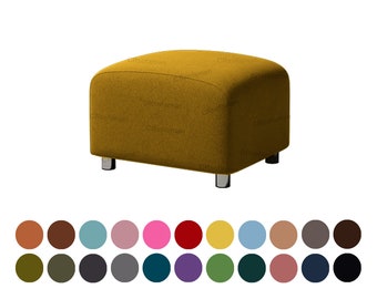 May include: A mustard yellow fabric ottoman with rounded edges and silver legs.