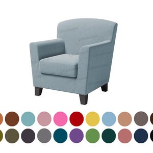 May include: A light blue armchair with a curved back and wooden legs. The chair is upholstered in a soft, textured fabric.