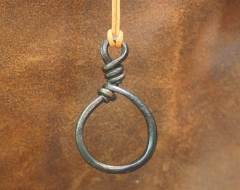 Circular iron pendant. Hand forged of scrap metal.