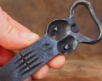 Hand forged bottle openers. Medium. Fun bottle openers. Forged. Metal. Faces