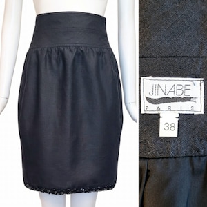 May include: Black high-waisted skirt with a sequined hem and a JINABE PARIS label with size 38.