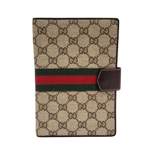 Porta pasaporte o tarjetero de lona con GG de GUCCI, años 70, vintage