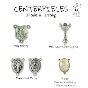 May include: A collection of silver-toned metal rosary centrepieces featuring the Holy Family, a Holy Communion chalice, a Miraculous Medal, and a custom photo frame. The text reads CENTERPIECES (Made in Italy) and A SUBLIME IDEA.