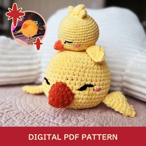 May include: A crocheted yellow chick toy with a smaller yellow chick on top. The chicks have orange beaks and black eyes. The toy is sitting on a pink and white blanket. DIGITAL PDF PATTERN.
