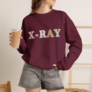 Sweatshirt mit Retro-Röntgenaufnäher | Medizinische Röntgen-Typografie