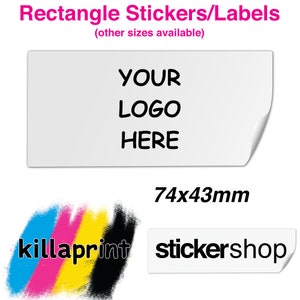 May include: White rectangular label with the text "YOUR LOGO HERE". The label measures 7.4cm x 4.3cm. The image also includes the text "Rectangle Stickers/Labels" and the logos for "killaprint" and "stickershop".