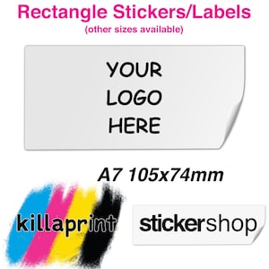 May include: White rectangular sticker with the text "YOUR LOGO HERE" in black. The sticker is 105mm by 74mm and is labelled "A7 105x74mm". The sticker is shown on a white background with a colourful graphic of the words "killaprint" and a white sticker with the text "stickershop" in black.
