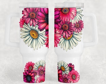 May include: White tumbler with a handle, featuring a vibrant floral design of pink and white daisies. The tumbler includes a clear lid and a white straw. The floral arrangement is on both sides of the tumbler.