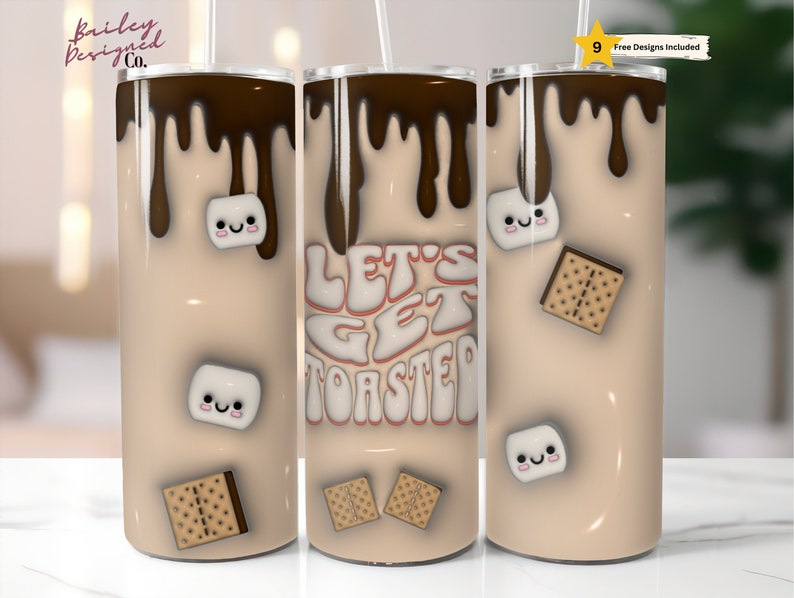 K&ouml;nnte beinhalten: Drei Edelstahlbecher mit braunem und beigefarbenem Design. Die Becher zeigen eine Grafik einer Marshmallow, eines Graham-Crackers und Schokolade mit dem Text "Let's Get Toasted".