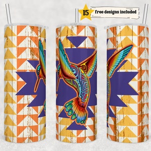 May include: A stainless steel tumbler with a colorful hummingbird design on a geometric background. The tumbler has a purple, orange, and yellow geometric pattern. The hummingbird is colorful with blue, green, red, and yellow accents. The tumbler is 20 ounces.