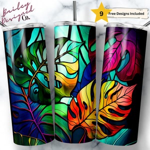 May include: Three stainless steel tumblers with colorful, abstract leaf designs. The designs feature shades of blue, green, yellow, orange, red, and purple.
