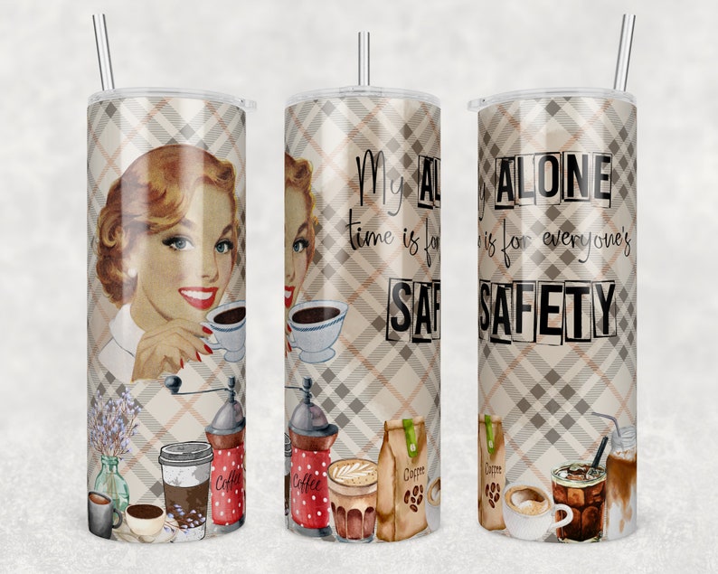 May include: A stainless steel tumbler with a plaid pattern and a retro-style illustration of a woman drinking coffee. The tumbler has the text "My alone time is for everyone's safety" printed on it.