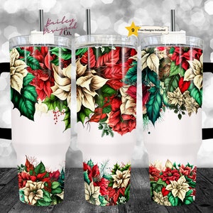 May include: A white tumbler with a black handle and a design of red and white poinsettia flowers with green leaves. The tumbler is 30 oz and has a straw.