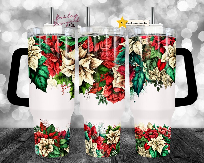 May include: A white tumbler with a black handle and a design of red and white poinsettia flowers with green leaves. The tumbler is 30 oz and has a straw.