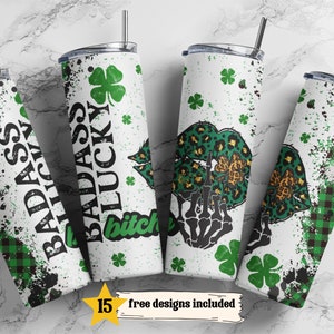 May include: Four white stainless steel tumblers with black straws. Each tumbler features a unique design with green and black accents, shamrocks, and bold text. One tumbler reads "BADASS LUCKY BITCH". The image includes the text "15 free designs included".