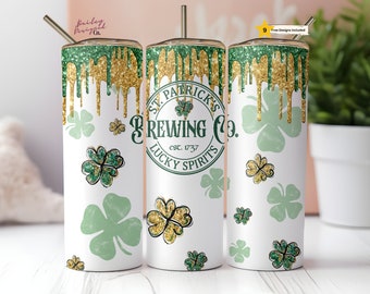 May include: A white tumbler with a green and gold glitter design. The tumbler has a green shamrock design with the text "St. Patrick's Brewing Co. est. 1737 Lucky Spirits".