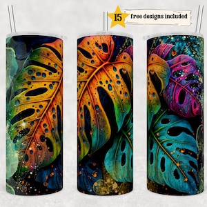 Puede incluir: Tres vasos de acero inoxidable con un diseño de hojas tropicales de colores. Las hojas son una mezcla de amarillo, naranja, verde, azul y morado con detalles de purpurina dorada. Los vasos son de 20 oz.