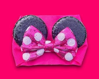 May include: Pink headband with black ears and a pink and white polka dot bow.