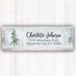 May include: A watercolor-style return address label with a wintery forest scene. The text reads "Charlotte Johnson, 1234 Anywhere Blvd., Anywhere City, CA 93000".