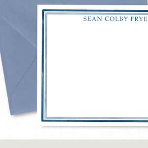 May include: A white stationery card with a blue border and the name "SEAN COLBY FRYE" printed at the top.