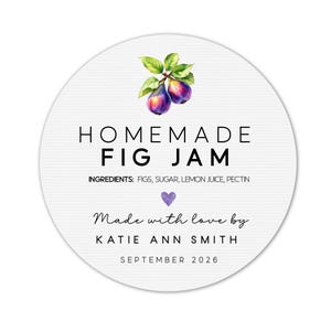 May include: A round white label with the text "HOMEMADE FIG JAM" and the ingredients listed below. The label features a watercolor illustration of figs and leaves at the top, a purple heart, and the text "Made with love by KATIE ANN SMITH SEPTEMBER 2026."