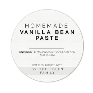 May include: A round label with the text "HOMEMADE VANILLA BEAN PASTE" in black. The label also lists ingredients: Madagascar vanilla beans and vodka. It is bottled August 2025 by The Edlen Family.