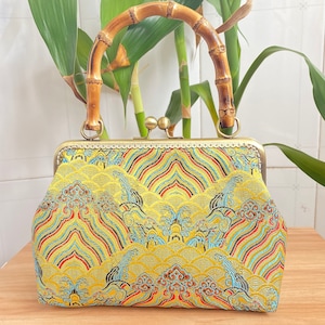 Bambusgriff Brokat Retro im chinesischen Stil Sea Wave Muster Tragetasche Handtasche