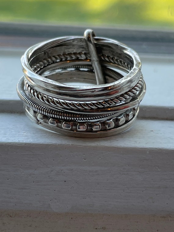 7 stackable Sterling Rings All different