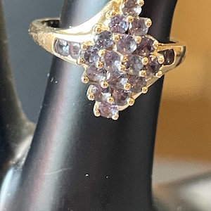 14k Yellow Gold Ring with Blue Topaz Pave stones in a Diamond setting Two additional Blue Topaz Stones on  sides of setting. Ring SZ 7.