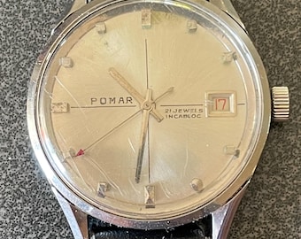 Vintage 1960’s/70’s Pomar ( France ) wristwatch. 35.8. mm case. Silvered Dial with Crosshairs Raised applied silver hour and minute makers.