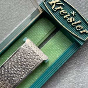 NOS with case Classic Kreisler Stainless Steel Center Expansion Watch Band. Quintcential watch band of the 60’s and 70’s. 5 3/4 inches long