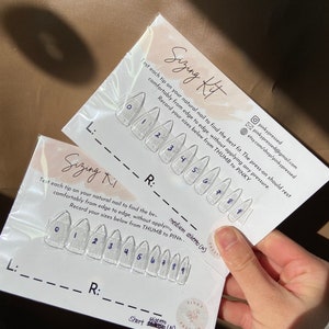 May include: Sizing kit for press-on nails with instructions to measure your nail size. The kit includes ten clear press-on nails numbered 0 through 9. The instructions say to test each tip on your natural nail to find the best fit. The press-on should rest comfortably from edge to edge, without applying any pressure. Record your sizes below from thumb to pinky.